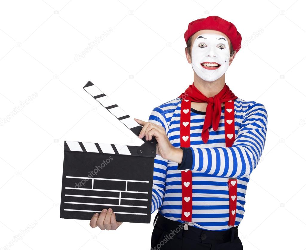 Emotional funny mime actor wearing sailor suit, red beret posing