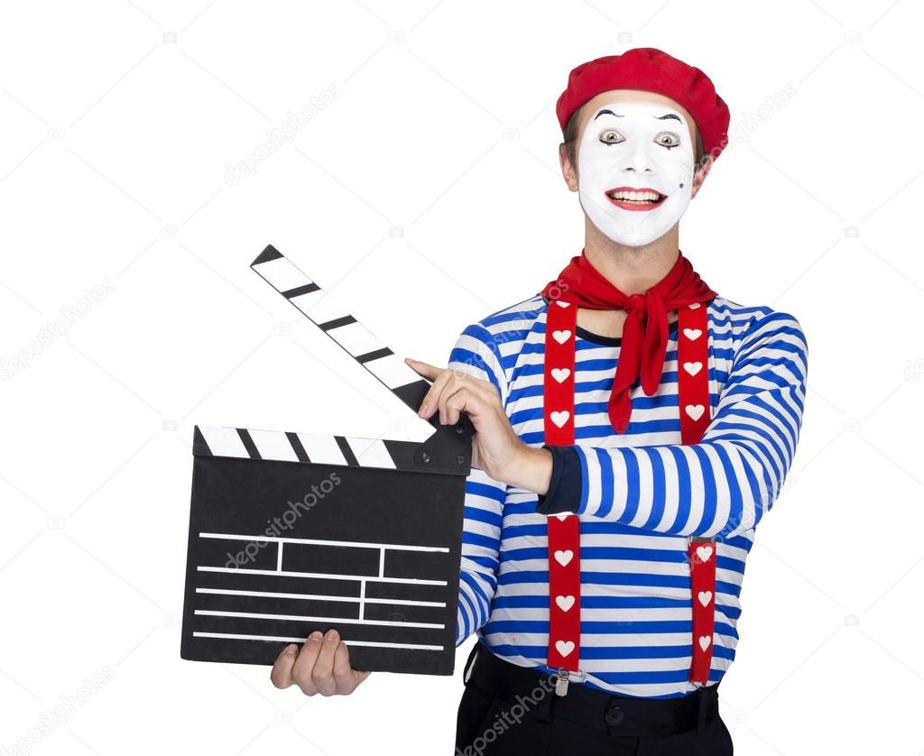 Emotional funny mime actor wearing sailor suit, red beret posing on white background.