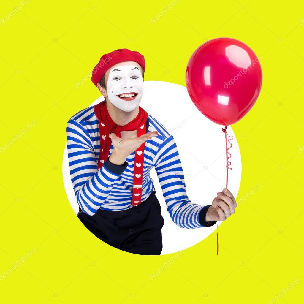 Mime with balloon.Emotional funny actor wearing sailor suit, red beret posing on color white green isolated background.
