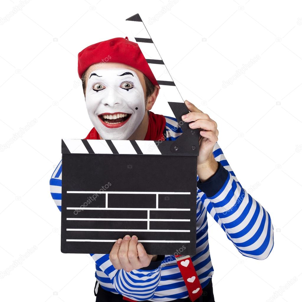 Emotional funny mime actor wearing sailor suit, red beret posing on white isolated background.