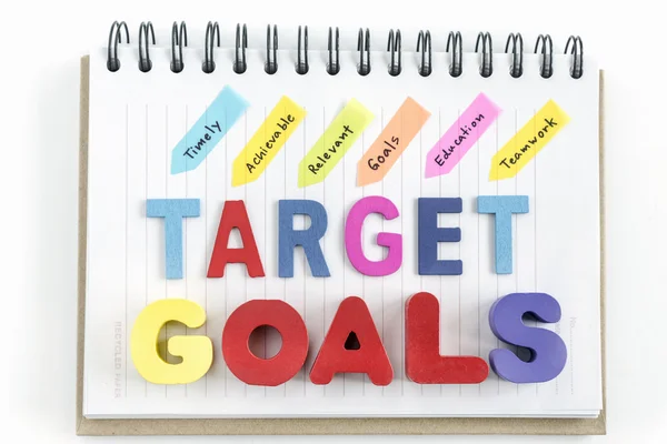 Words goals target on notebook over white background — Stock Photo, Image