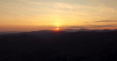 Mountain landscape, sunset and silhouettes of mountains hills, 4k video