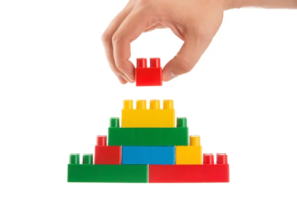 레고, 비즈니스 개념을 쌓아 벽을 구축 하는 손 — 스톡 사진