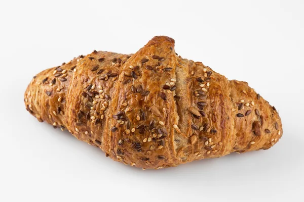 Franska vete croissant med frön isolerade — Stockfoto