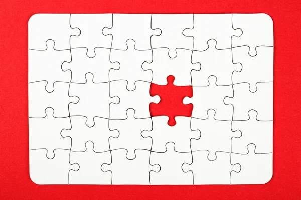 Business conception, puzzle pieces over red background — Stock Photo, Image