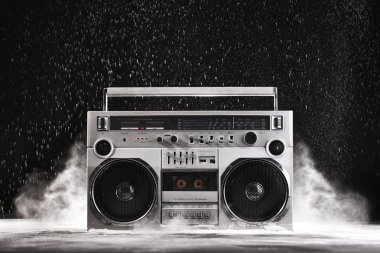 1980s Silver Retro ghetto blaster and dust isolated on black wit clipart