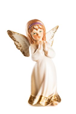 Christmas angel toy with crossed hands isolated on white backgro clipart