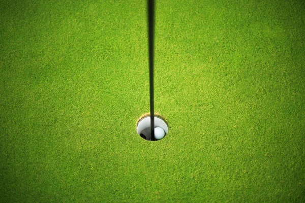 Golf ball at the hole — Stock Photo, Image