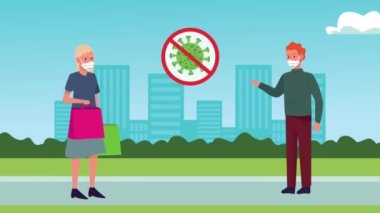 Şehirde sosyal mesafeli tıbbi maskeler takan bir çift.