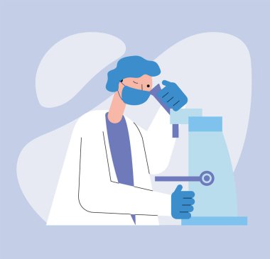 Erkek doktor laboratuvarı mikroskop kullanıyor.