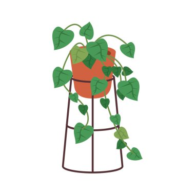 Turuncu seramik saksı dekoru metal tezgahta.