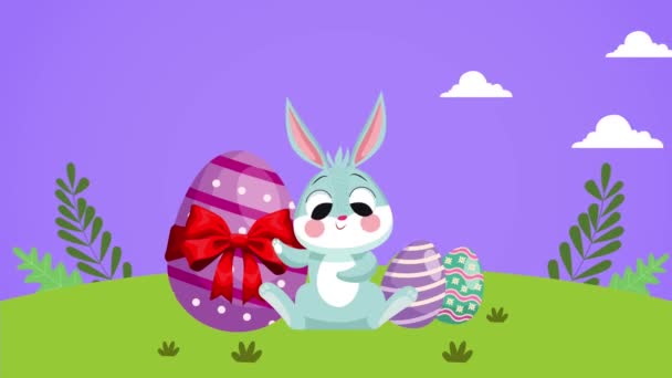 Glad påsk dag med söta kaniner och ägg målade på fältet — Stockvideo