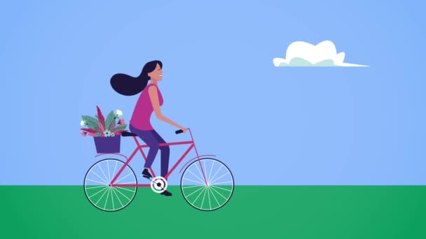 Tarjeta feliz día de las mujeres con la mujer en bicicleta en el campo — Vídeo de stock