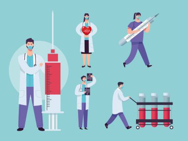 Klinik ekipmanlarıyla yüz maskesi takan tıbbi personel