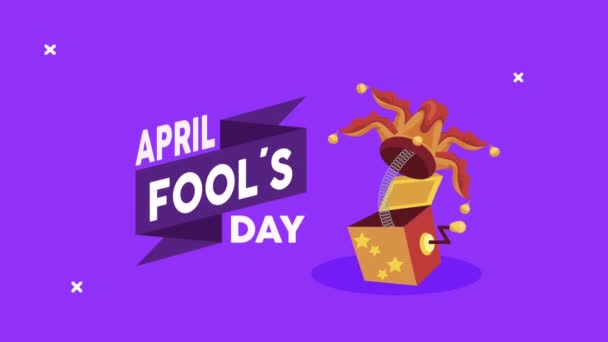 April dwazen dag belettering met nar hoed springen in doos — Stockvideo