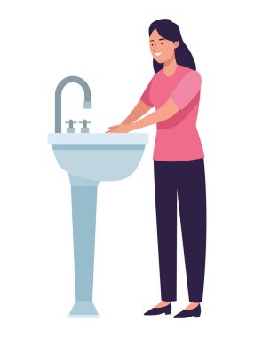 Kadın ellerini yıkıyor.