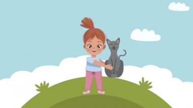 Küçük kız kamp sahnesinde kediyi kaldırıyor.