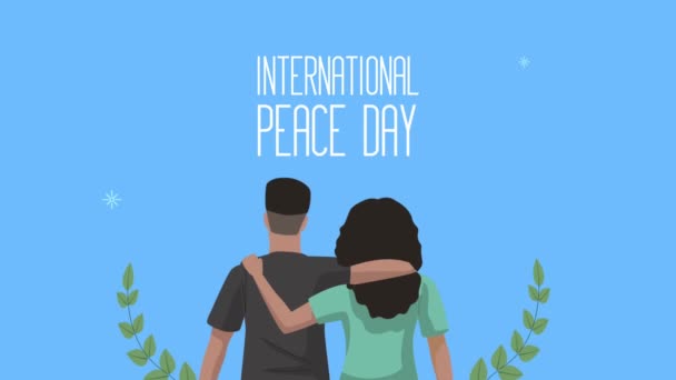 Internationell fredsdag bokstäver med älskare par och krans — Stockvideo