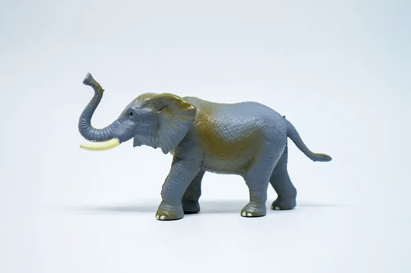 Pequeño juguete de elefante en el lado —  Fotos de Stock