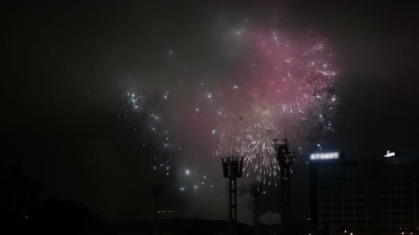 Wonderful fireworks over a football stadium at night. — Stock Video