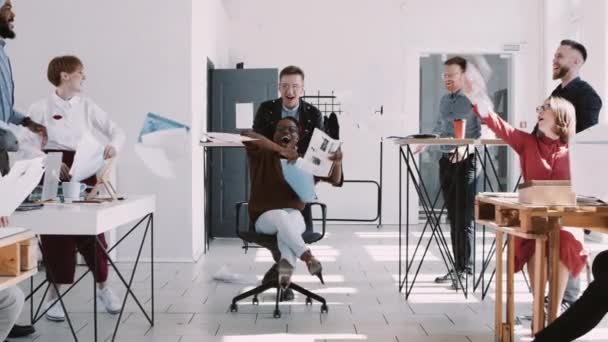 RED EPIC-W Healthy workplace, happy young black business woman celebrates career success with office team slow motion — Stock Video
