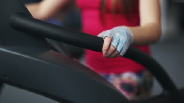 Woman running on a treadmill at the gym — Stock Video