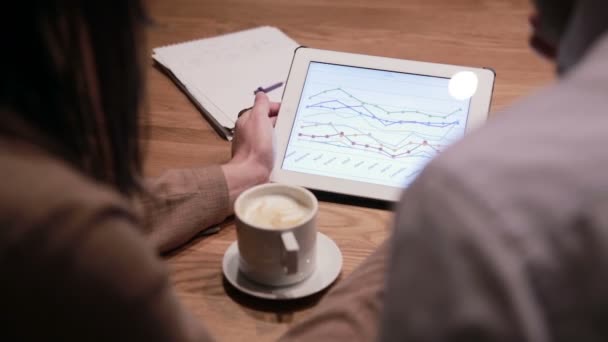 Business people working with charts on tablet — Stock Video