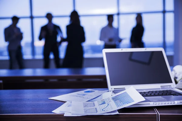 Several colleagues communicating in office against window — Stock Photo, Image