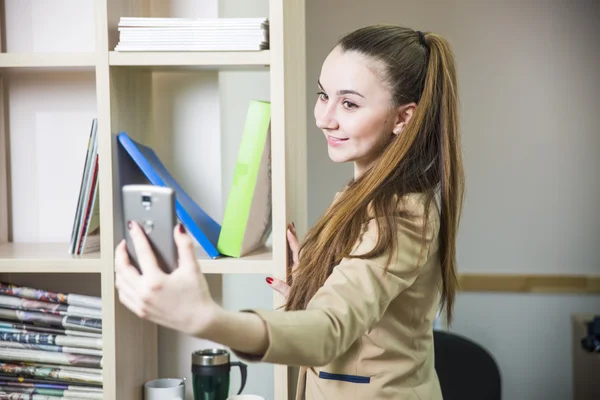 Pretty girl student office worker taking selfie