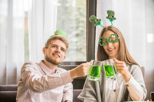 a couple young people celebrate St. Patrick\'s Day