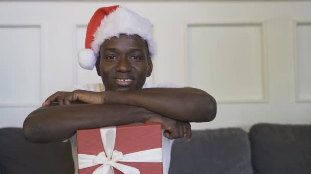 Afro American Guy Smile Holding Christmas Gift His Hands — Stock Video