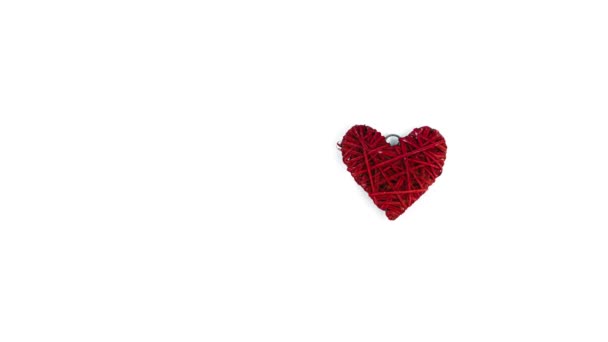 Stop motion footage of red heart loading on white background — Stock Video