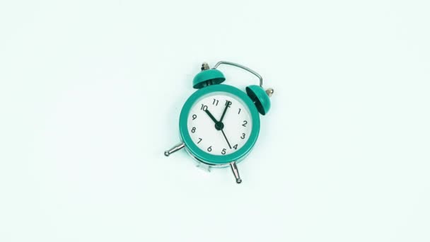 Stop motion footage of alarm clock ringing on white background — Stock Video