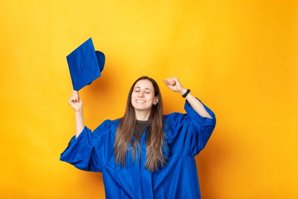 Photo of cheerful woman celebrating success and graduating.