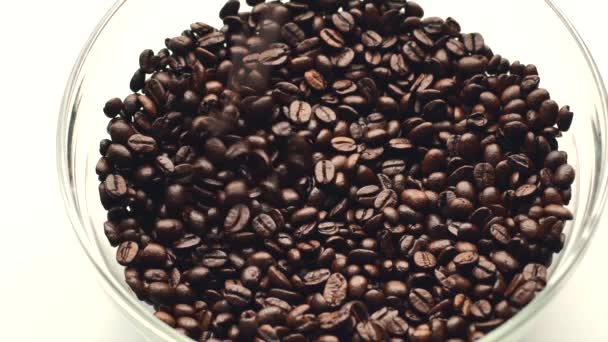 Close up footage of pouring fresh roasted coffee beans in a bowl — Stock Video