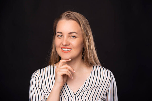 Portrait of young beautiful business woman looking at the camera and smiling.