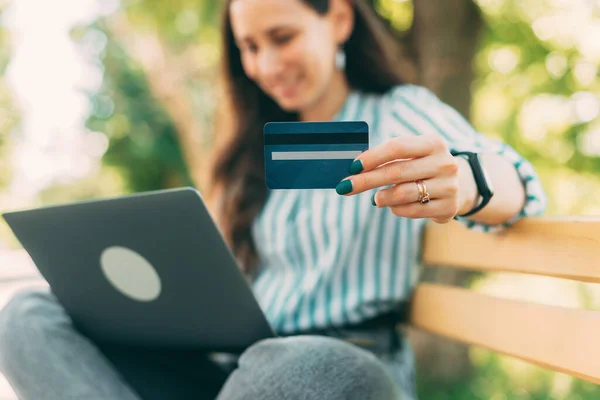 Selective Focus Woman Holding Blue Credit Card Outdoors — Stock Photo, Image