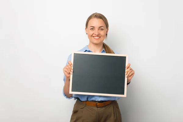 Young Stylish Woman Holds Blackboard Studio White Background — Stock fotografie