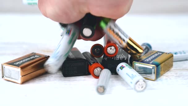 Moldova, Chisinau, 23 September 2021, Close up footage of man recycling old batteries — 图库视频影像