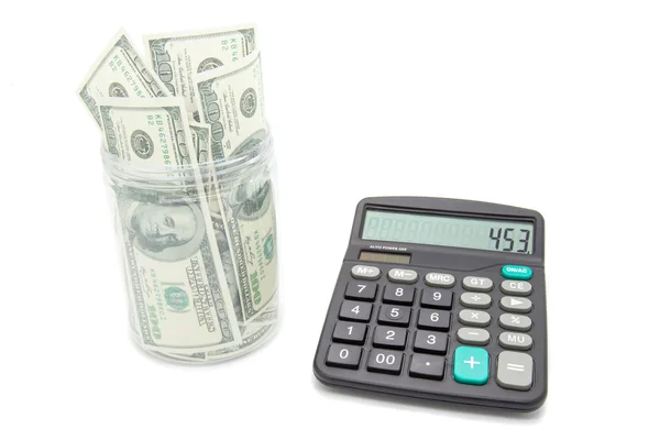 Vaso di denaro e calcolatrice — Foto Stock