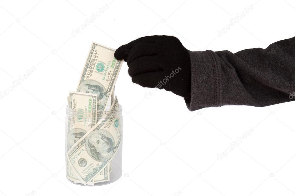 Mano Con Guanto Nero Rubare Soldi Da Un Barattolo Foto Stock Foto Immagini C Beebright Depositphotos