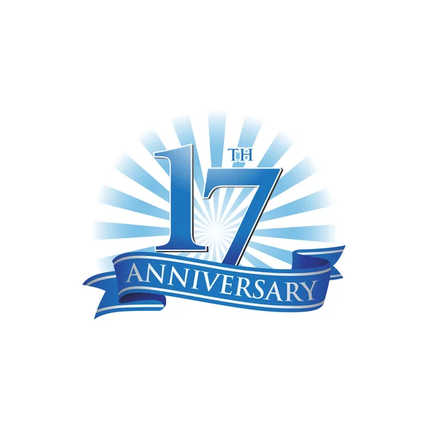 17 rocznica wstążki logo niebieskie promienie światła — Wektor stockowy