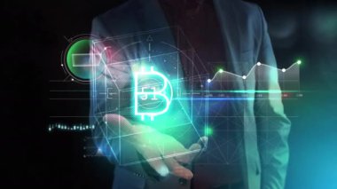 Bir erkek avucunda Bitcoin sanal bilgi grafikleri.