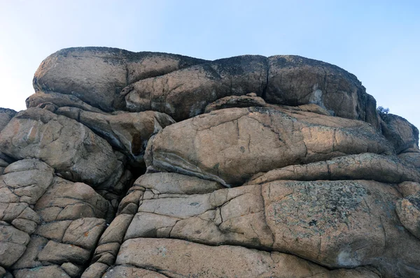 Rock on a background of blue sky — Stock Photo, Image