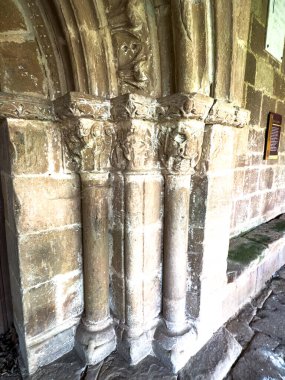 Close-up of Romanesque carved capitals and columns with decorative motifs