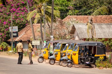 Two tuk-tuk rickshaw drivers clipart