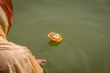 Hindu woman makes and Aarti offering clipart