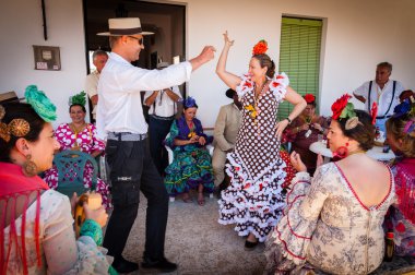 Pilgrims celebrating in flamenco style clipart