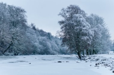 Dochart in Killin, Scotland frozen in mid winter clipart