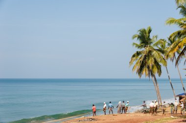 Fishermen pulling a large fishing net